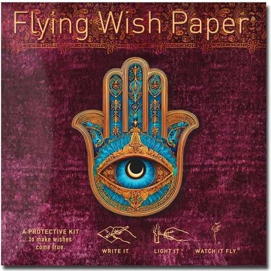 Flying Wish Paper packaging with decorative hand design and eye symbol on a purple background
