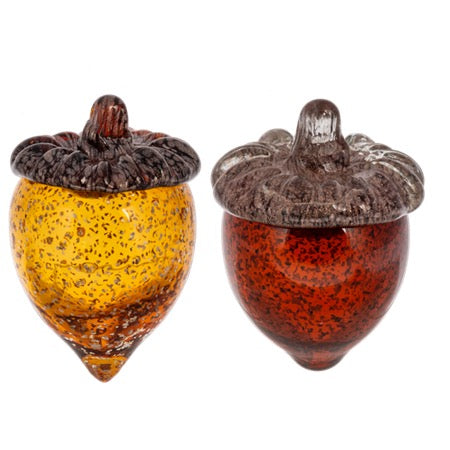 Two glass acorn ornaments, one orange and one red, on a white background