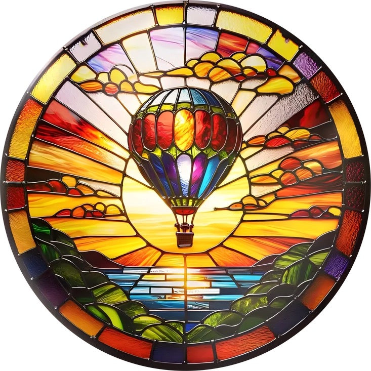 Stained glass artwork of a hot air balloon in a colorful landscape