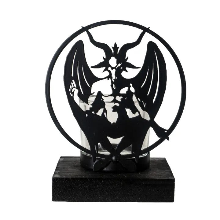 Decorative black metal sculpture of a winged figure on a white background