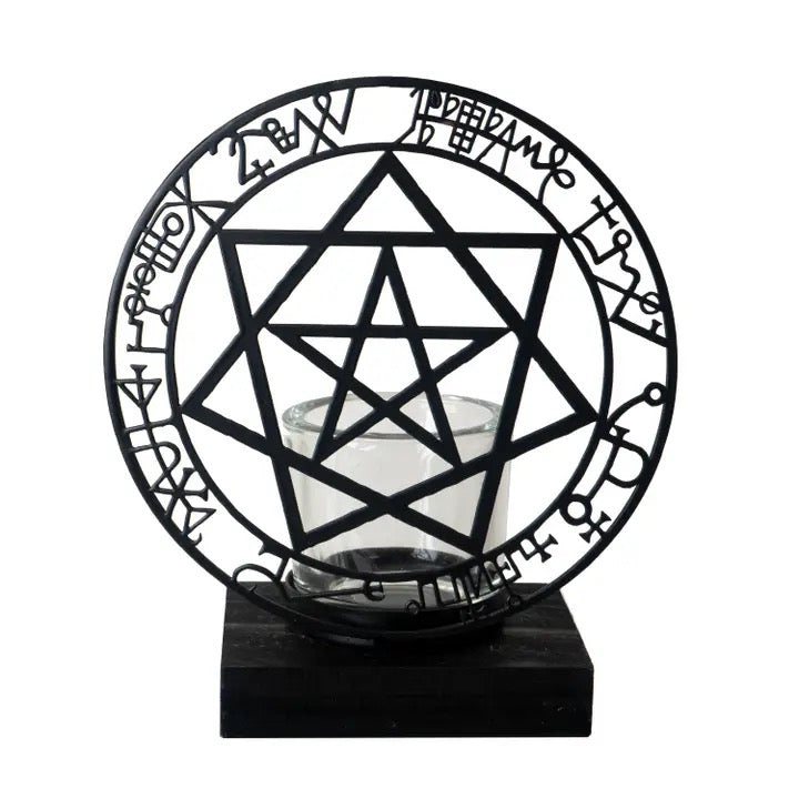 Decorative candle holder with geometric design and sigils on a white background