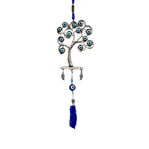 Decorative tree with blue evil eye beads on a white background