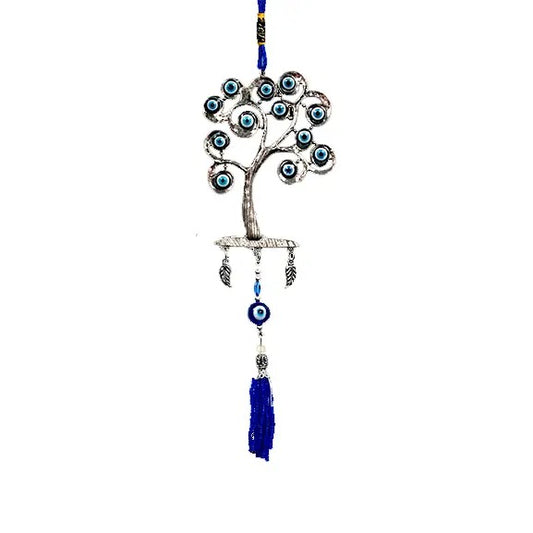 Decorative tree with blue evil eye beads on a white background