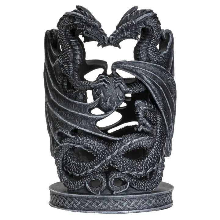 Decorative black dragon sculpture on a white background