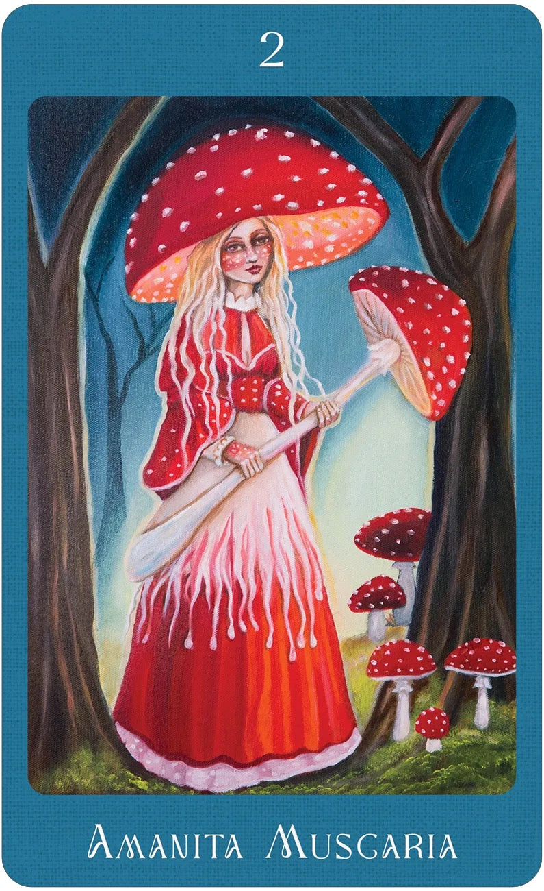 Card featuring a woman in a red dress with a large mushroom in a forest setting, labeled 'Amanita Muscaria'.