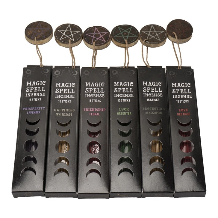 Set of Magic Spell Incense Sticks with various scents in black boxes on a white background