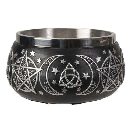 Black bowl with silver star, moon, and triangle designs on a white background