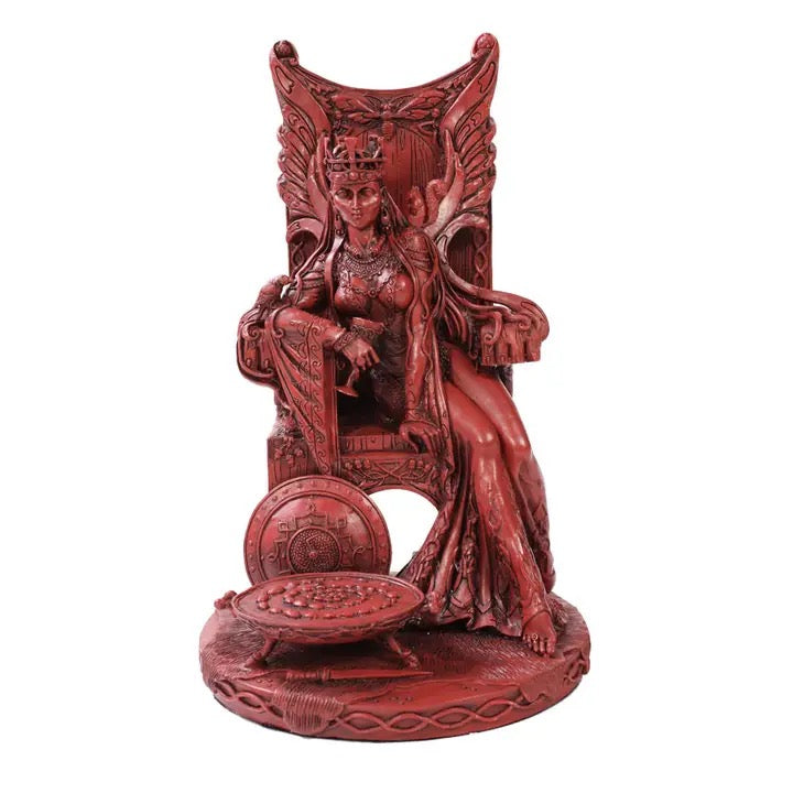 Red figurine of a woman on a throne with intricate details on a white background
