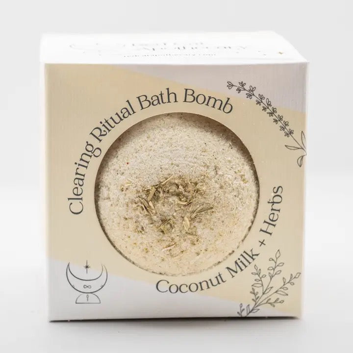 Bath bomb packaging with coconut milk and herbs on a white background