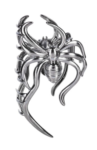 Metallic spider-shaped hair clip on a white background