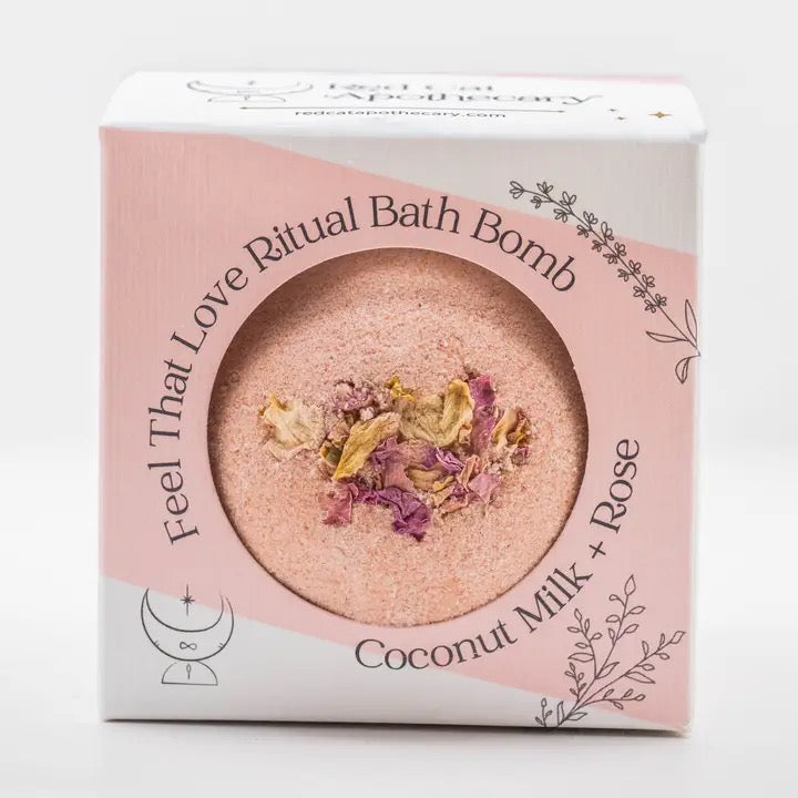 Bath bomb packaging with coconut milk and rose ingredients on a white background