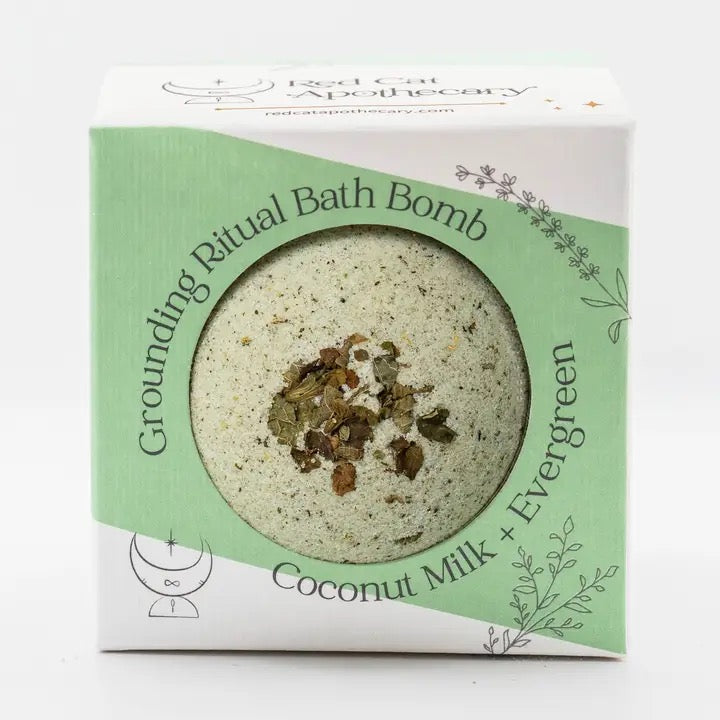 Bath bomb packaging with coconut milk and evergreen scent on a white background