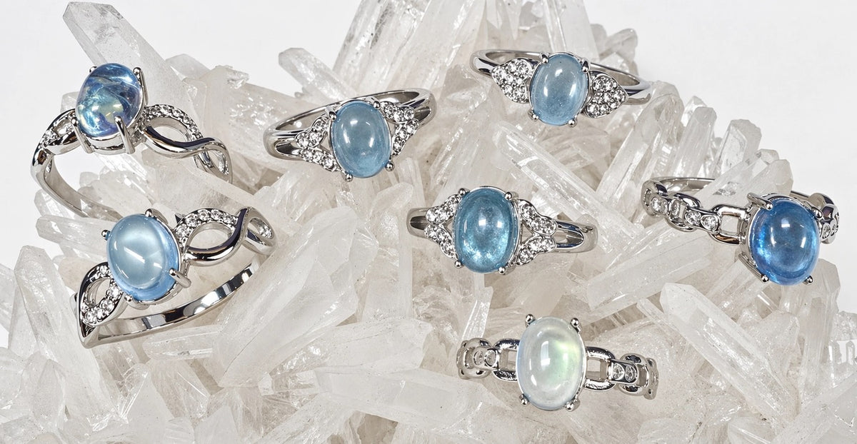 Assorted Rings Blue Aquamarine Oval stones with zircon crystals Stainless Steel setting on a quartz crystal