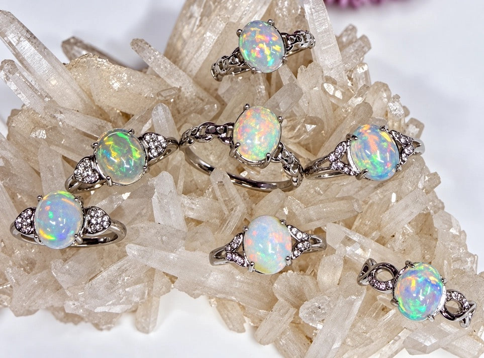 Assorted Rings Opal Natural Oval Stainless Steel 8x10 mm stone size on a quartz Crystal