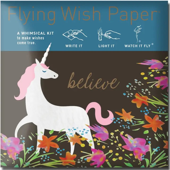 Flying Wish Paper packaging with unicorn illustration and colorful flowers on a dark background
