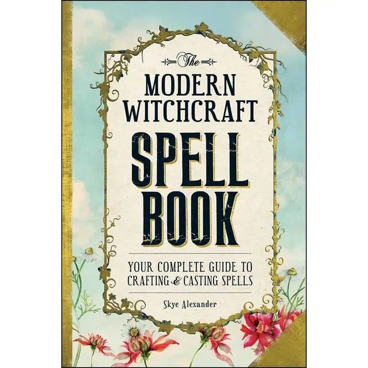 Book titled 'The Modern Witchcraft Spell Book' with decorative elements and floral design on a light background.