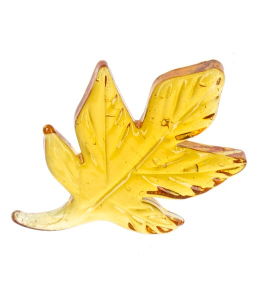 Yellow leaf-shaped object on a white background