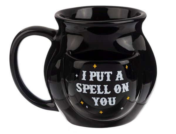 Black mug with 'I Put a Spell on You' text on a white background