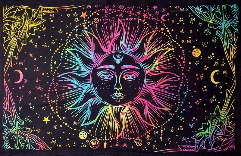 A black tapestry or wall hanging featuring a vibrant, neon rainbow-colored psychedelic design of a sun face surrounded by stars, moons, and floral corner details.