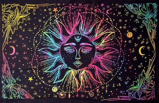 A black tapestry or wall hanging featuring a vibrant, neon rainbow-colored psychedelic design of a sun face surrounded by stars, moons, and floral corner details.