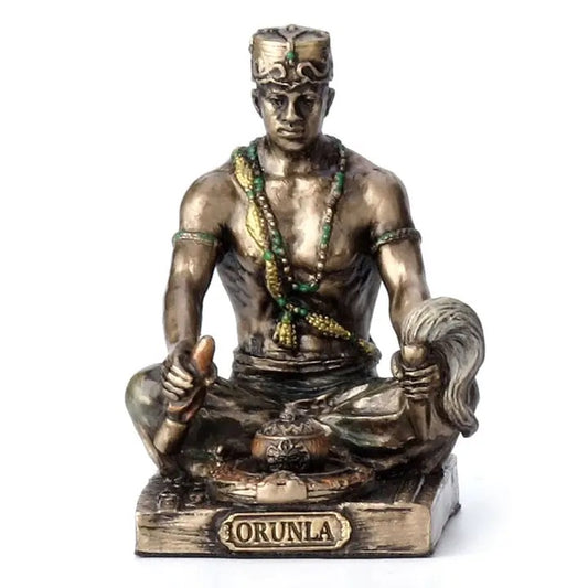 Statue of a seated figure with 'Orunla' inscription on a white background