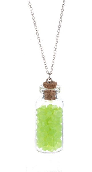 Necklace with a glass bottle pendant containing green beads on a white background