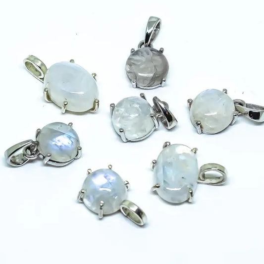 Set of silver pendants with moonstone stones on a white background