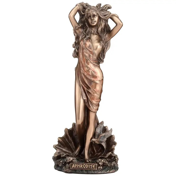 Bronze statue of a woman with flowing hair on a white background