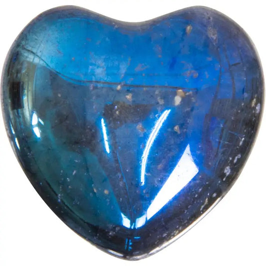 Heart-shaped blue gemstone on a white background