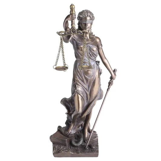 Statue of a woman holding scales and a sword on a white background