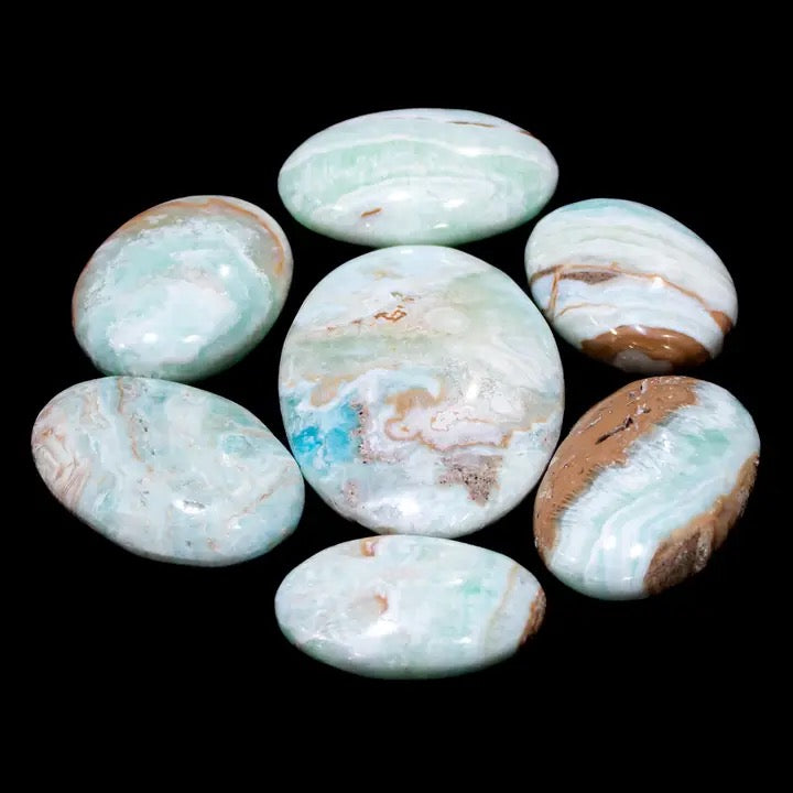 Set of marbled stones on a black background
