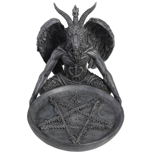Statue of Baphomet a being with wings and horns, sitting on a pentagram symbol, on a white background.