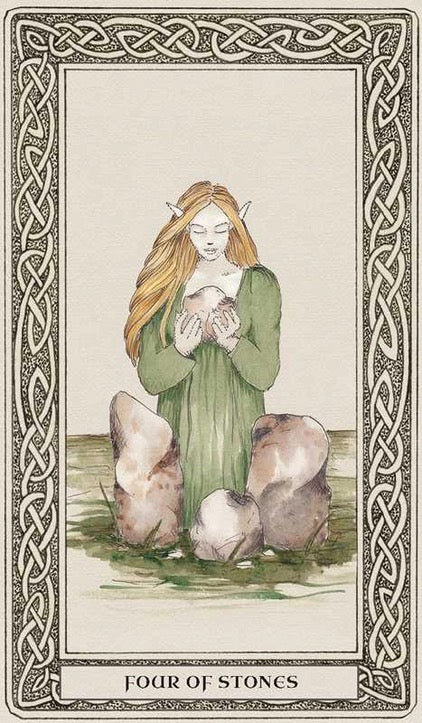 A tarot card illustration titled 'FOUR OF STONES' showing a woman with long blonde hair kneeling among large stones and holding a small white animal, framed by an ornate Celtic border.