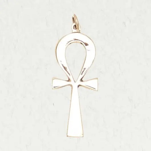Bronze ankh cross pendant on a light gray background