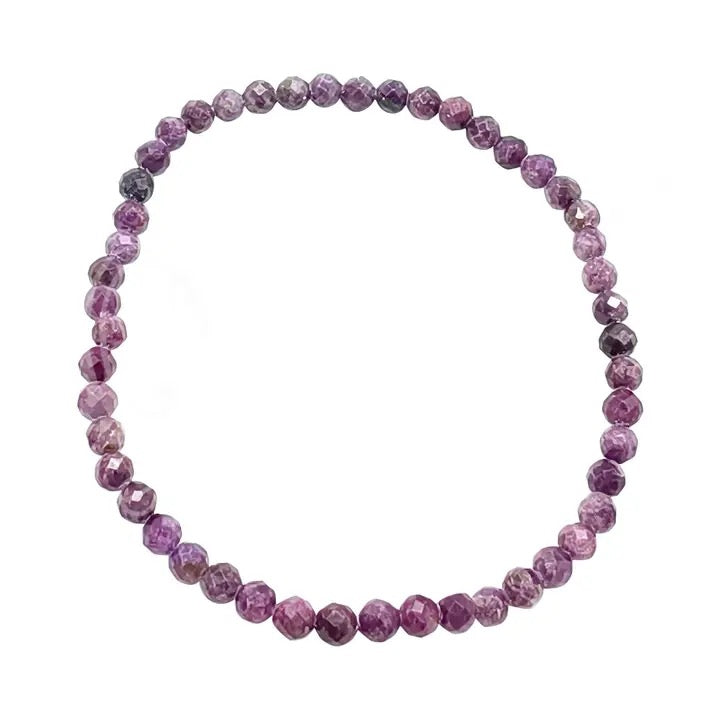 A beaded stretch bracelet made of faceted round beads in shades of purple and pink, arranged in a circle on a plain white background.