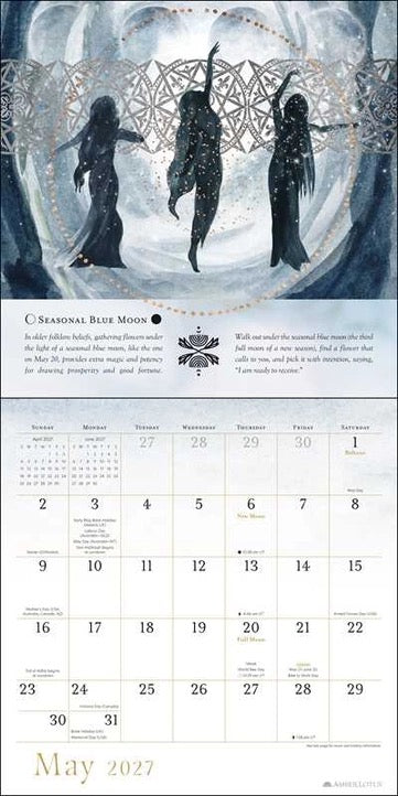 A printed calendar page featuring an illustrated seasonal blue moon scene at the top and a May 2027 calendar grid at the bottom, with decorative text and a small logo.