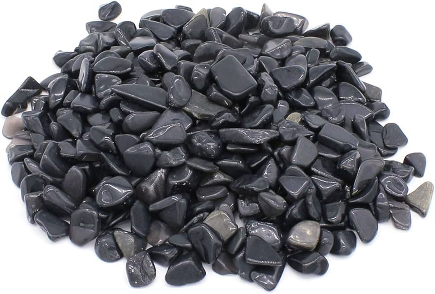 Pile of black stones on a white background