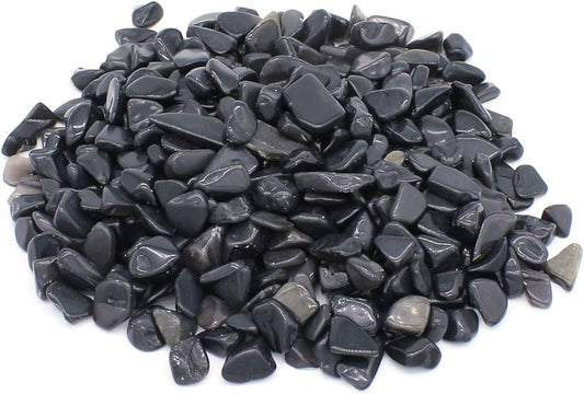 Pile of black stones on a white background