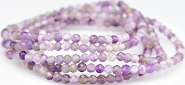 Purple beaded bracelet on a white background