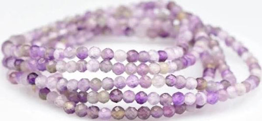Purple beaded bracelet on a white background