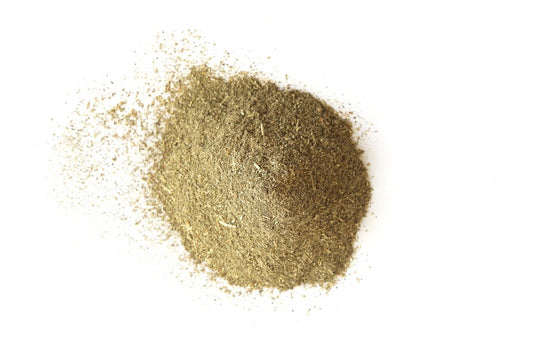 Close-up of gold powder on a white background