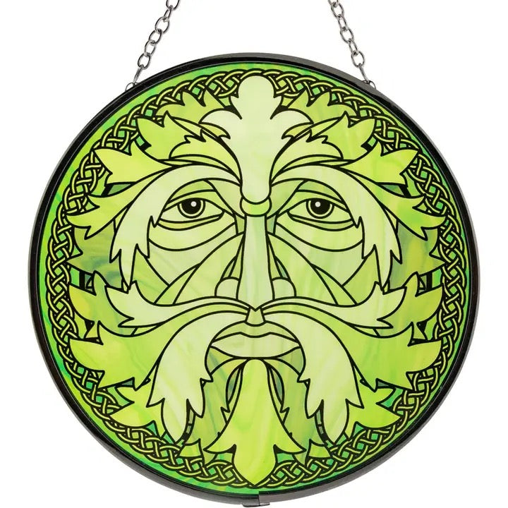 Circular green leafy design with Celtic patterns on a white background