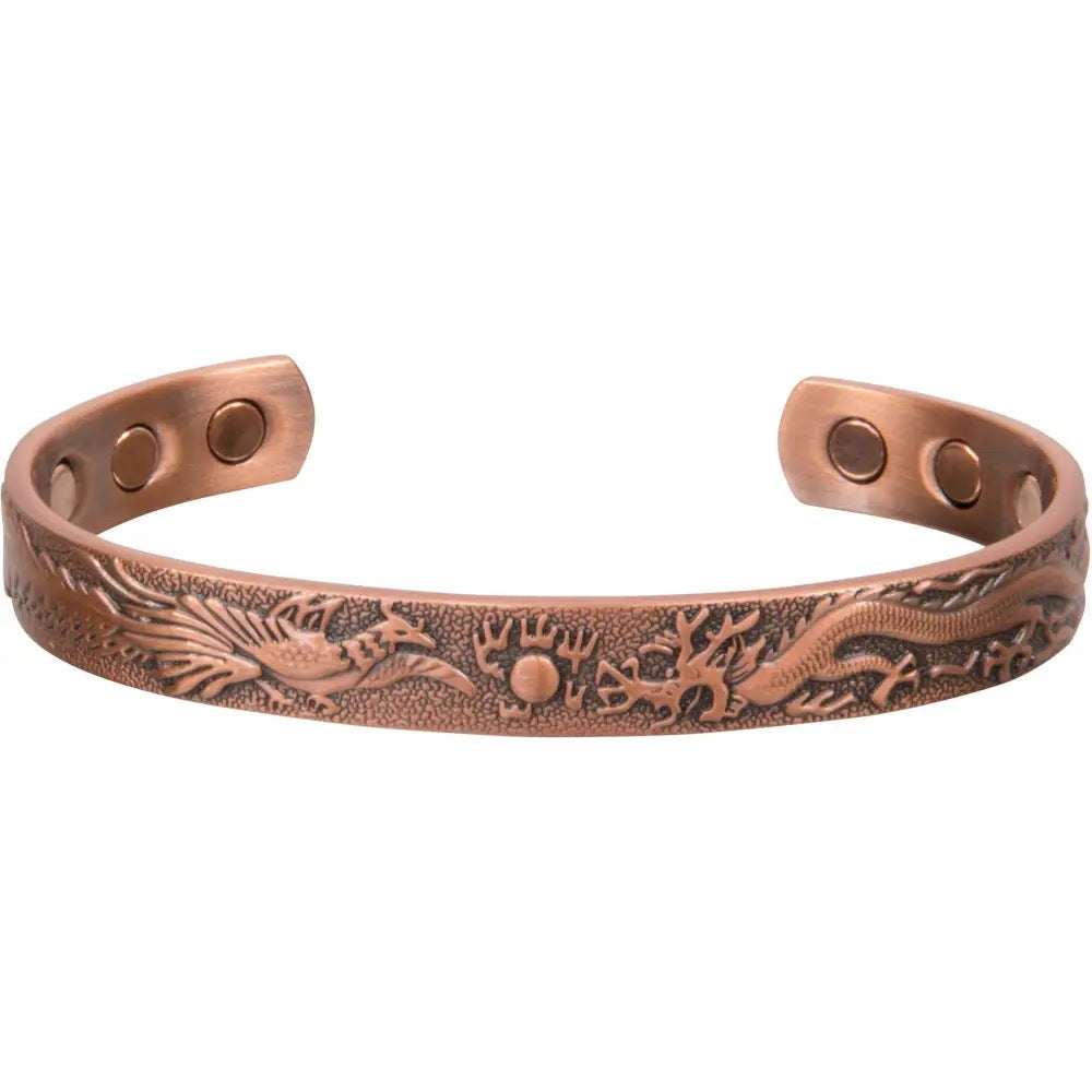 Copper bracelet with embossed design on a white background