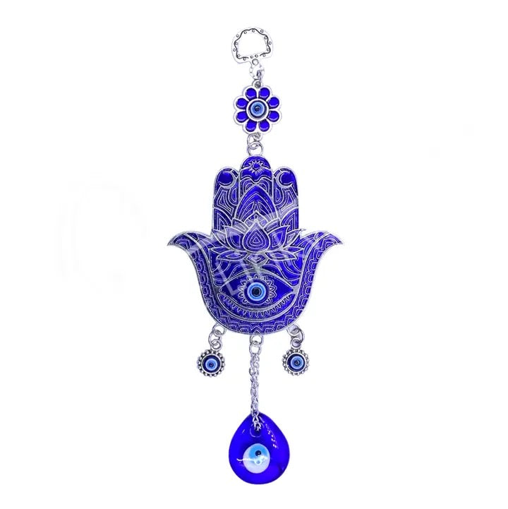 Decorative blue Hamsa hand with evil eye charm on a white background