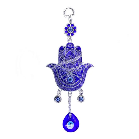 Decorative blue Hamsa hand with evil eye charm on a white background