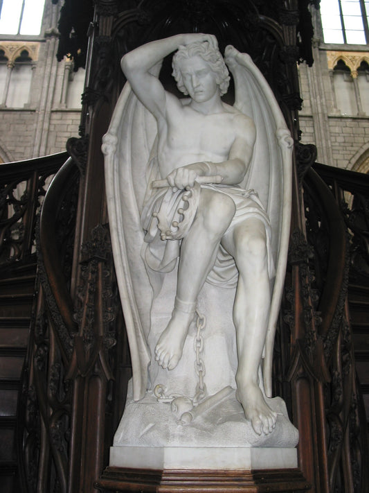 Statue of a winged figure in a cathedral setting