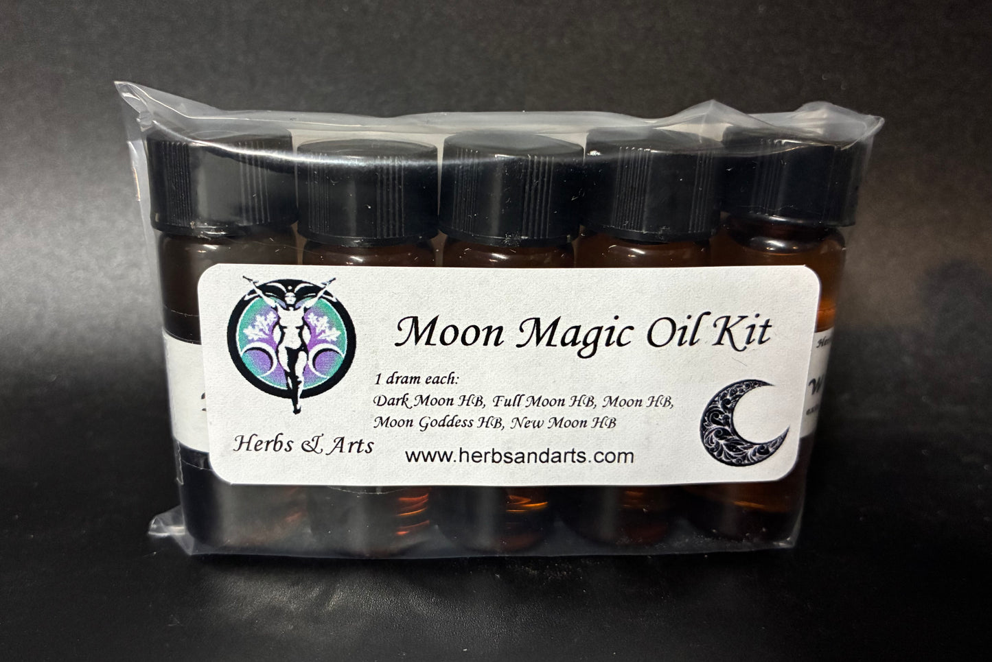 Moon Magic Oil Kit with labels on a dark background