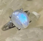 Silver ring with a large gemstone on a white background