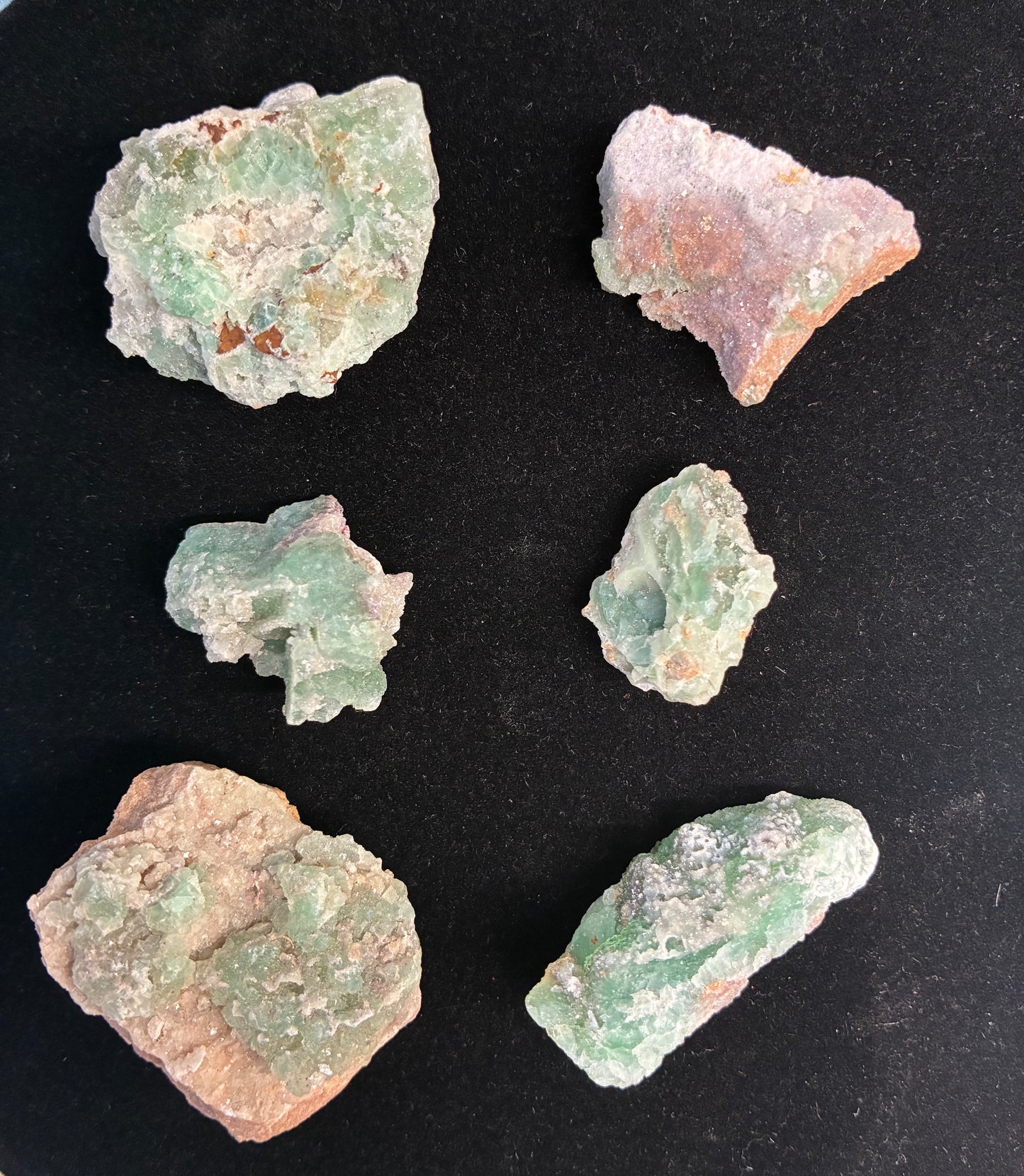 Mineral specimens on a black background