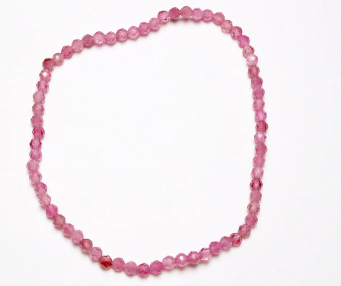 Necklace with pink beads on a white background